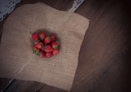 Strawberry on old wooden background, love and valentine themeの写真素材