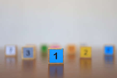 Wooden blocks with numbers, The concept of being a winning person and being a chosen person.の写真素材