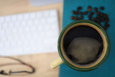Coffee cup on the desk, Coffee refreshes and awakesの写真素材