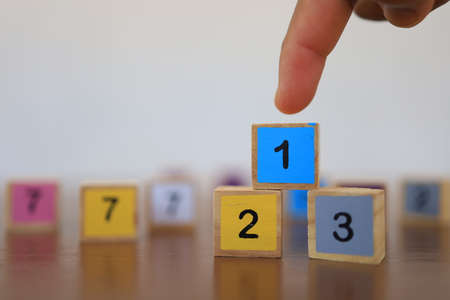Wooden blocks with numbers, The concept of being a winning person and being a chosen person.の写真素材