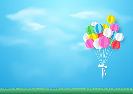 Colorful balloons flying over grass. Paper art and craft styleのイラスト素材