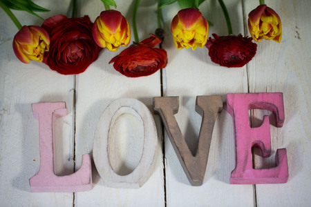 Love Letter with tulips on wooden backgroundの写真素材