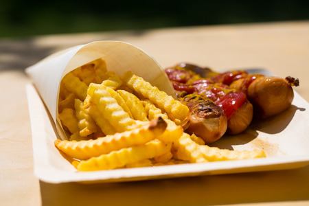 Currywurst and pommes on recyclable dishesの写真素材