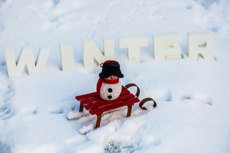 Snowman, Snowwoman in Snow, with Winter Lettersの写真素材