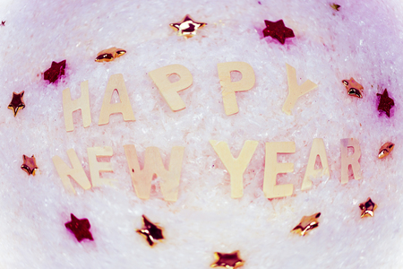 Happy New Year lying in the snowの写真素材