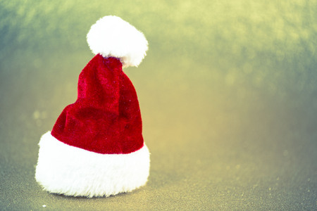 Santa hat on a gold backgroundの写真素材