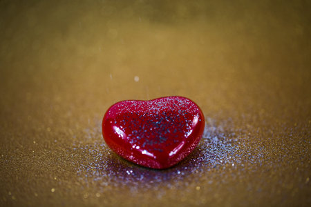 red heart on a gold background
