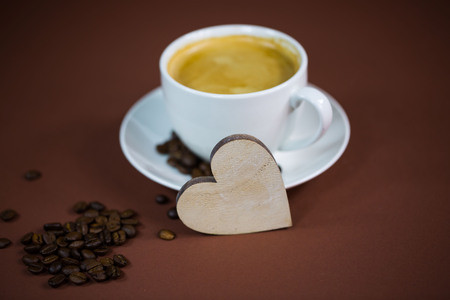 cup of coffee with heart, brown background, invitation, cardの写真素材