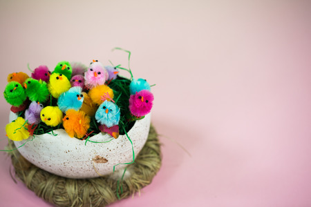 Easter basket with lots of little chicks, pastel backgroundの写真素材