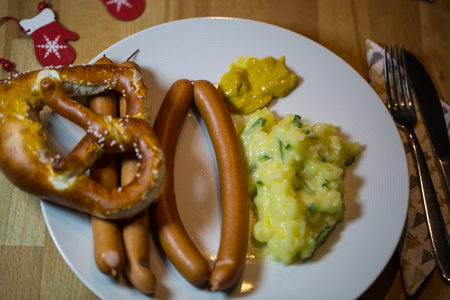 Traditional Christmas dinner in Germany, sausages and potato saladの写真素材