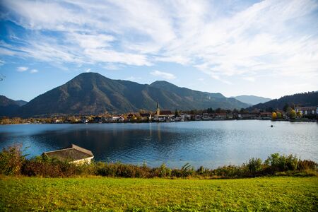 Tegernsee in autumn, with mountains in the background, churchの写真素材