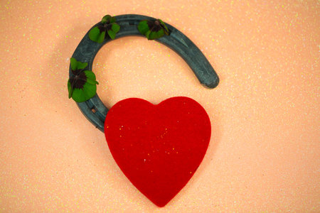 Horseshoe with a heart and shamrocksの写真素材