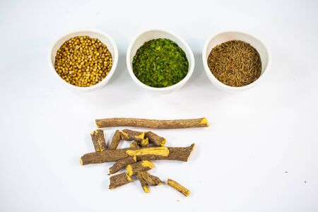 Parsley, coriander, caraway and licorice on a white backgroundの写真素材