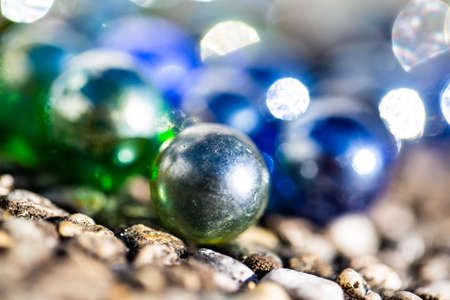 Playing marbles, old children's game, colorful ballsの写真素材