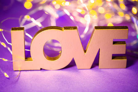Love written with bokeh. Postcard, background, tulipsの写真素材