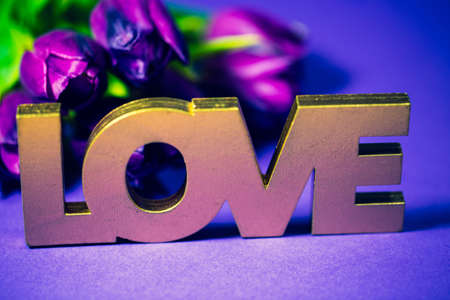 Love written with bokeh. Postcard, background, tulipsの写真素材