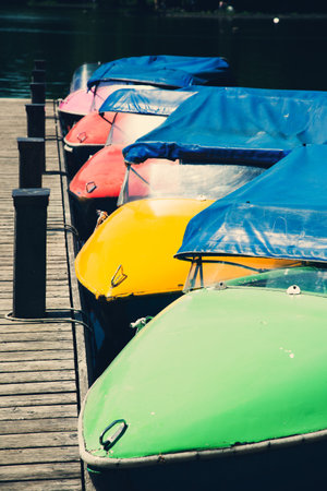 Pedal boats in the Kleinhesseloher See in the English Garden in Munich, Bavaria
