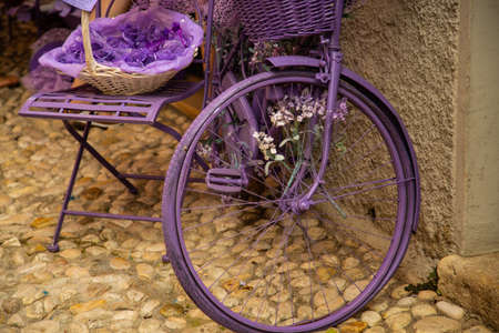 purple bike as a decoration in the front of the storeの写真素材