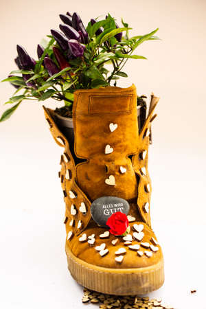 old shoes with hearts and roses, backgroundの写真素材