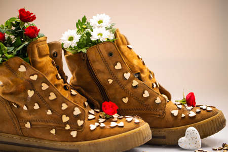 old shoes with hearts and roses, backgroundの写真素材