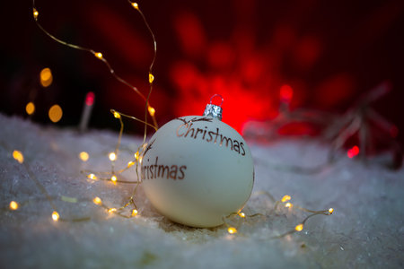 Christmas balls in the snow with lights