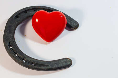 horseshoe with heart on white backgroundの写真素材