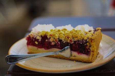 homemade cherry crumble cake slice with sprinkles topping