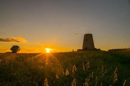 Went up to Cleadom Hill to Watch  the sunset, whist I was waiting a couple sat on the bench Watching the sun go downの写真素材