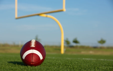 American Football with the Goal Posts or Uprights in the Background
