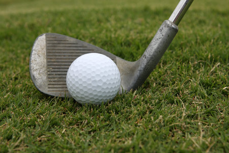 Golf Ball with a used pitching wedge