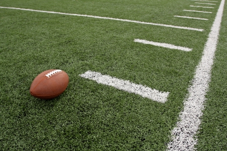 American Football near yard lines of the fieldの写真素材