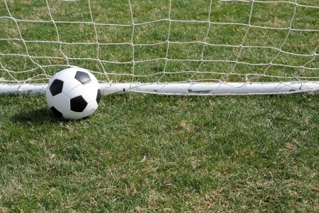 Soccer ball in the goal scoringの写真素材