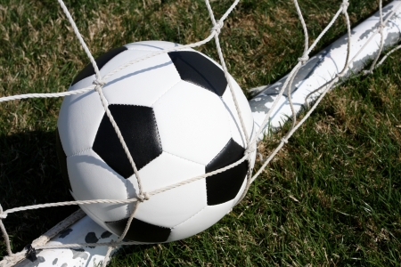 Soccer ball in the goal net scoringの写真素材