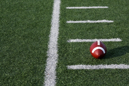 American Football on the field near yard lines or hashmarksの写真素材