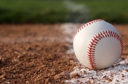 Baseball in the infield near the chalk lineの写真素材