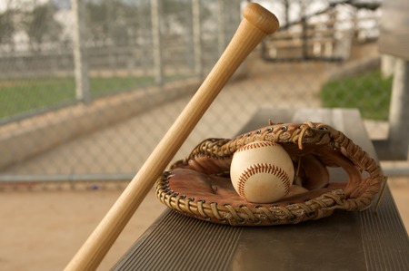 Baseball & Bat on the bench with a gloveの写真素材