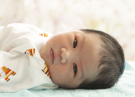 Asian baby looking in relax timeの写真素材