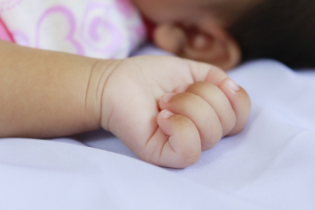 Closeup little hand of baby in sleep timeの写真素材