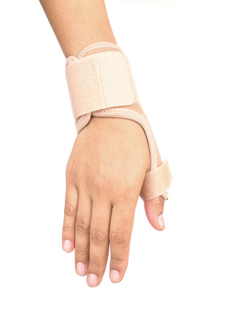 Close up of Thumb finger wrapped in an bandage on white backgroundの写真素材