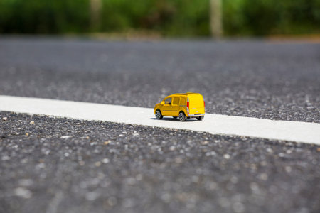 Miniature transport truck , yellow truck on the streetの写真素材