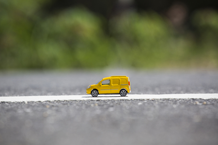 Miniature transport truck , yellow truck on the streetの写真素材