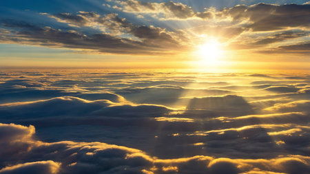 Sunset Over a Stunning Blue Sky with Sunbeams Piercing the Cloudsの写真素材