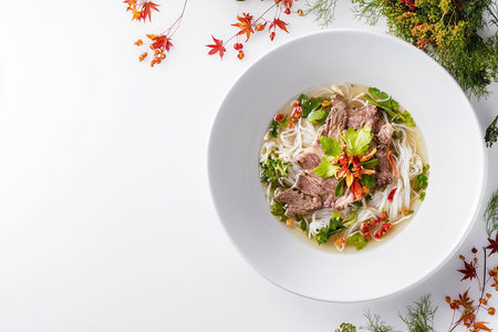 Classic Vietnamese Pho Fragrant Beef Broth with Rice Noodles, Sliced Beef, Bean Sprouts, Basil, and Limeの写真素材