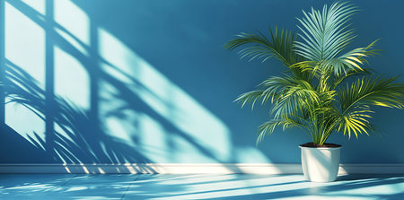 Sunlit Serenity A Potted Palm Against a Blue Wall, Boho Luxe Palm Shadow on Blue Wall for Product Displayの写真素材