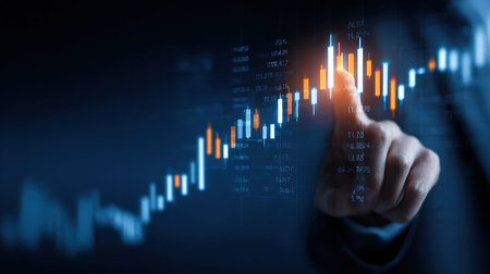 Hand interacting with rising stock market graphの写真素材