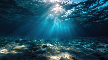 Underwater scene sunbeams ocean floor sandy seabedの写真素材