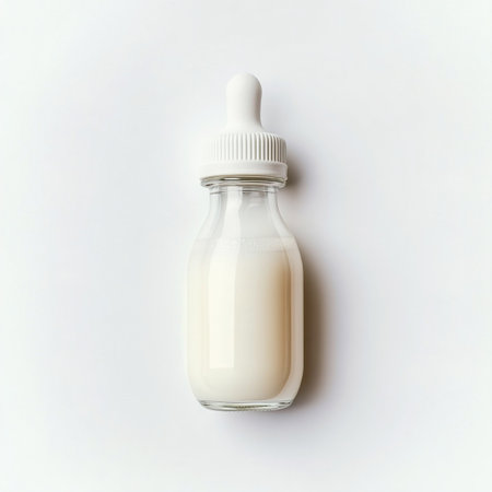 A glass bottle with milk on a white background. Top view.の写真素材