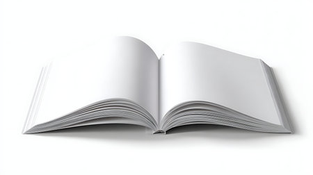 A wide-angle shot of an open book with blank white pages spread across a clean white surface. The...