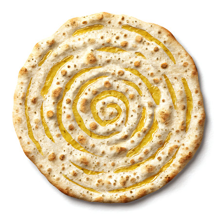 An overhead view of a round, golden-brown naan bread with a distinctive swirled pattern created by...