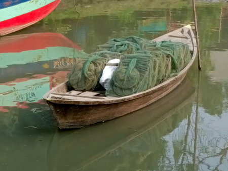 Fishing boats on the canal in Hoi An, Vietnam.の写真素材